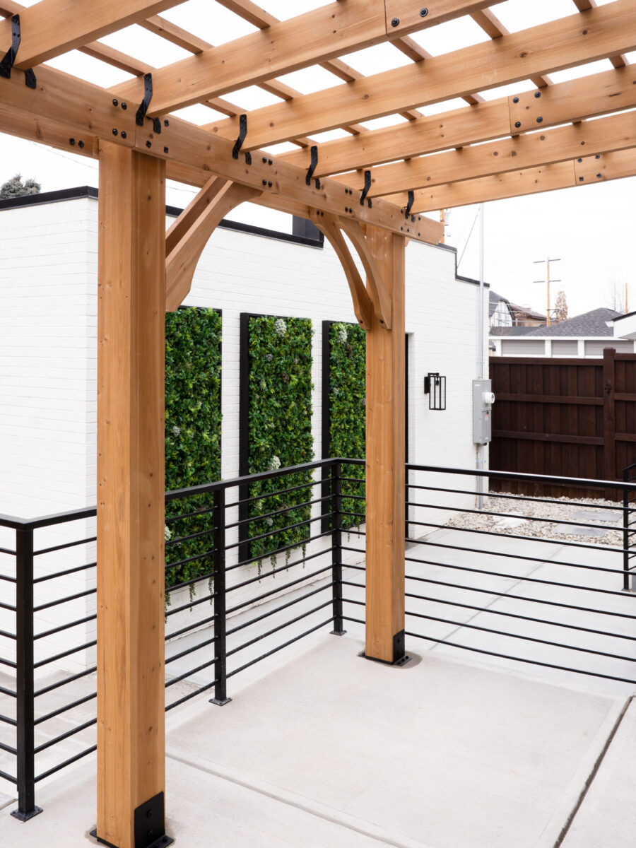 Modern timber pergola with black architectural railings